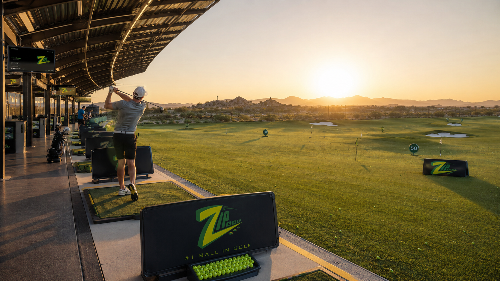 A golfer practicing at a branded driving range